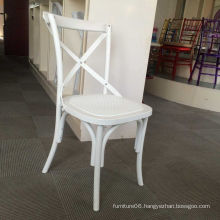 White Resin Plastic Cross Back Chair at Hotel